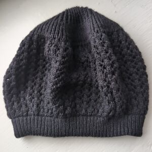 Black open knit or crochet-style beanie beret hat